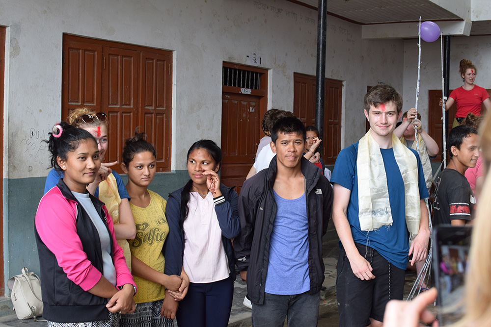 George doing activities with local students during the Mary Hare School Nepal trip with VoluntEars