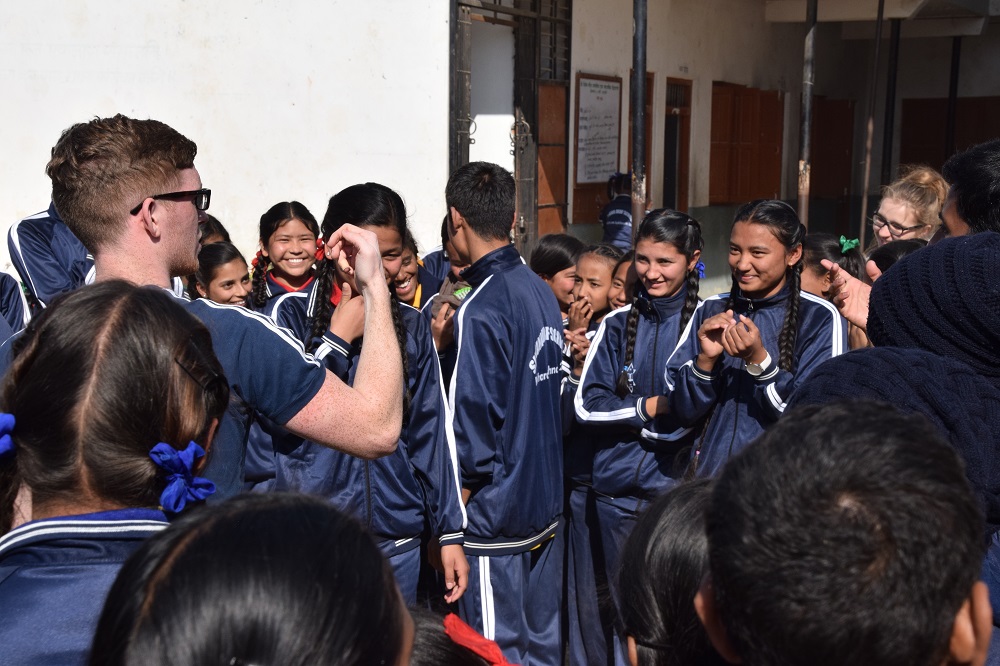 VoluntEars volunteer Ben Barlow doing an activity with Nepali deaf students