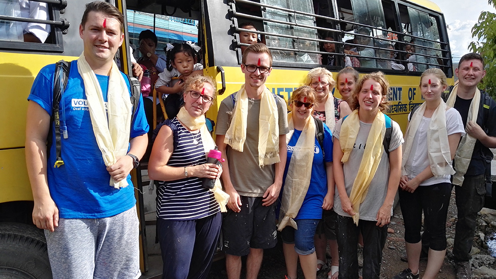 Volunteers arriving at school in Nepal on the Deaf school bus