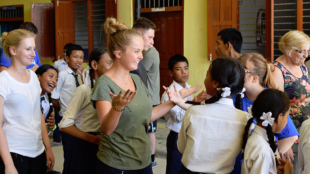 Libby doing activities with local students during her Nepal trip with VoluntEars