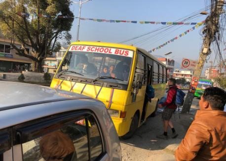Taking the bus to school every morning near Pokhara