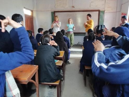 Sally and other volunteers take a class during the VoluntEars trip to Nepal