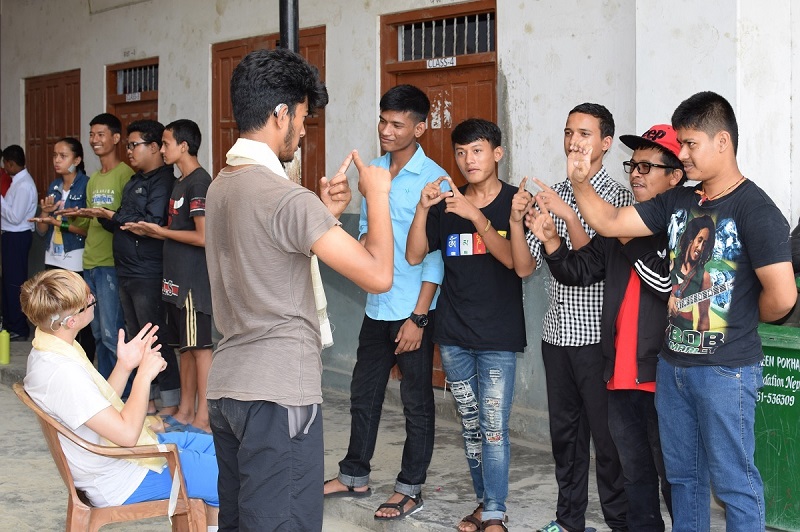 Volunteers doing activities with local deaf students in Nepal
