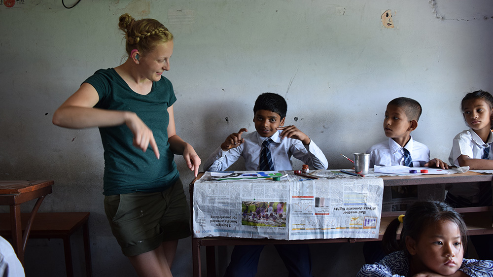 Ellie teaching at a Deaf school during her Nepal trip with VoluntEars