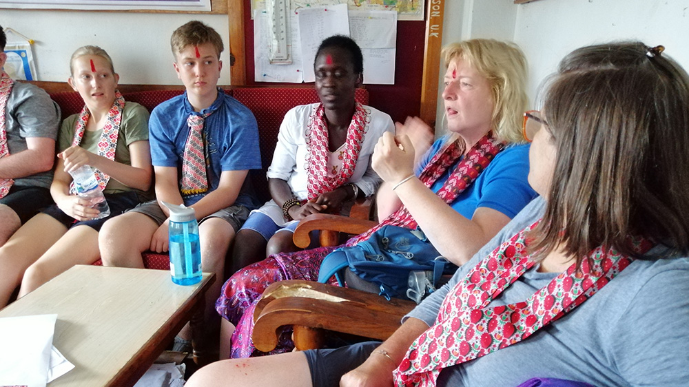 Janet discussing Deaf education with the volunteers and school Principal during her Nepal trip with VoluntEars