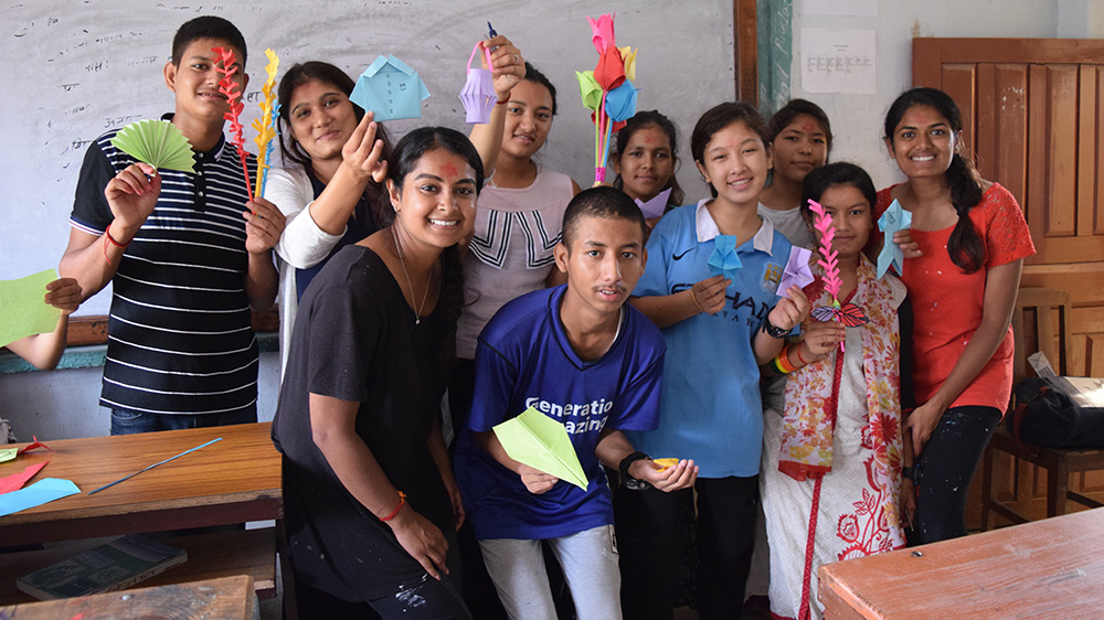 Minara helping in an art class at a Deaf school in Nepal 