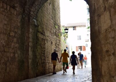 An arch over a cobbled street in Kotor old town in Montenegro