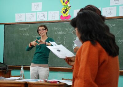 Female volunteer helping in a class in a deaf school in Peru