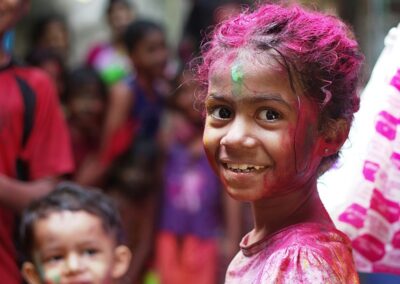 Indian girl with colourful powder on her face