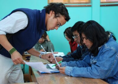 Male volunteer helping in a class in a deaf school in Peru