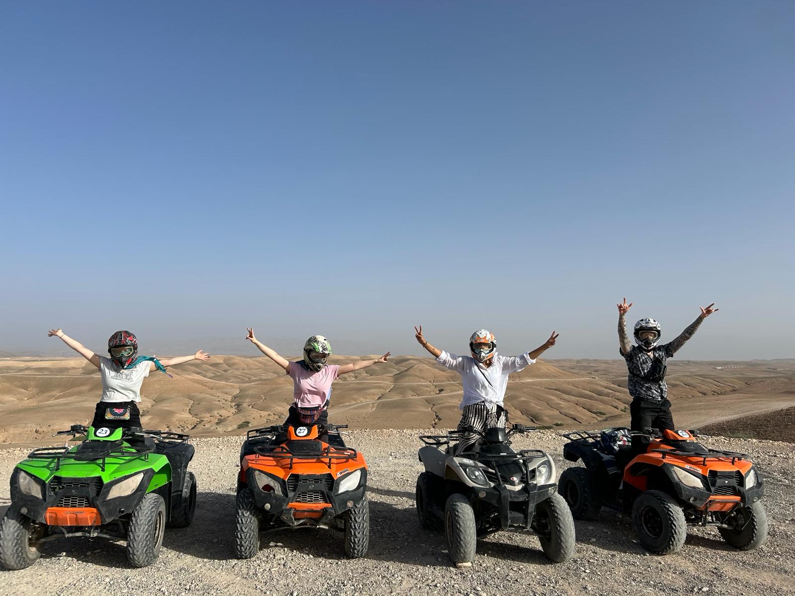 4 people on quad bikes in the countryside in Morocco on a deaf volunteering trip with VoluntEars 