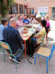 VoluntEars - eating lunch at a Deaf Association