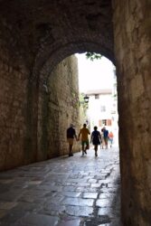 An arch over a cobbled street in Kotor old town in Montenegro