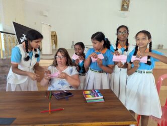 Amrit doing activities with deaf students in India - VoluntEars